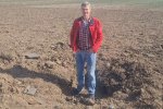 Kees on his plot near a crater of a Shahed kamikaze drone of Russian/Iranian manufacture