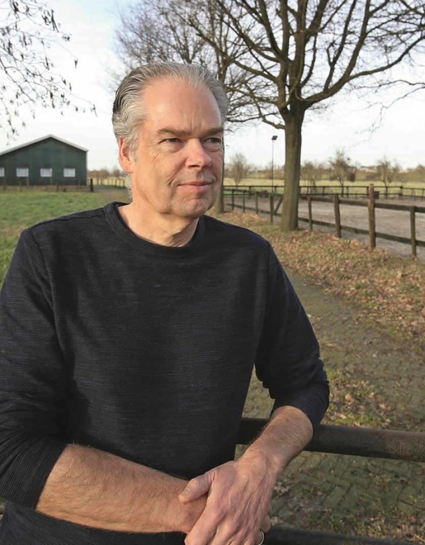 Marko Ruis standing in front of a farm Marko Ruis standing in front of a farm